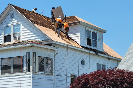 Roofing contractor roof replacement in new england home